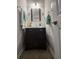 Bathroom featuring a vanity with dark wood cabinets at 1631 Royal Ives Dr, Lawrenceville, GA 30045