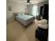Bedroom with a bed with blue covers, and a black bookshelf at 1631 Royal Ives Dr, Lawrenceville, GA 30045