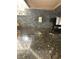 Dark granite countertop with black backsplash at 1631 Royal Ives Dr, Lawrenceville, GA 30045