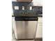 Stainless steel Frigidaire dishwasher with a black backsplash at 1631 Royal Ives Dr, Lawrenceville, GA 30045