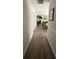 Bright hallway leading to a cozy living area with a fireplace at 1631 Royal Ives Dr, Lawrenceville, GA 30045