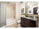 Well-appointed bathroom featuring a granite countertop, and shower-tub combo for a luxurious experience at 480 John Wesley Dobbs Ne Ave # 810, Atlanta, GA 30312