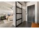 Beautiful primary bedroom showcasing an open sliding door to a modern bed and decor at 480 John Wesley Dobbs Ne Ave # 810, Atlanta, GA 30312