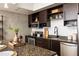 Elegant kitchen showcasing granite countertops, stainless steel appliances, and dark wood cabinetry at 480 John Wesley Dobbs Ne Ave # 810, Atlanta, GA 30312