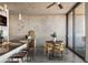 Modern living space featuring a sleek kitchen counter, dining area, and access to a balcony at 480 John Wesley Dobbs Ne Ave # 810, Atlanta, GA 30312