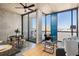 Open living area with modern furniture, large windows, and access to a balcony with seating at 480 John Wesley Dobbs Ne Ave # 810, Atlanta, GA 30312