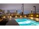 Inviting rooftop pool with dazzling city views at dusk at 480 John Wesley Dobbs Ne Ave # 810, Atlanta, GA 30312