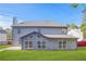 The backyard boasts a spacious lawn and a home exterior with large windows at 1021 Adah Ln, Lawrenceville, GA 30043