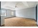 Spacious bedroom featuring a ceiling fan and two windows for ample natural light at 1021 Adah Ln, Lawrenceville, GA 30043