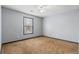 Sunny bedroom with a neutral color palette and natural light streaming through a window at 1021 Adah Ln, Lawrenceville, GA 30043