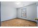 Bedroom with neutral carpet, light-blue walls, trim, and natural light from window at 1021 Adah Ln, Lawrenceville, GA 30043