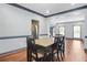 Dining area featuring hardwood floors, gray accent trim, and access to the kitchen at 1021 Adah Ln, Lawrenceville, GA 30043