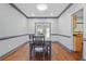Bright dining room features hardwood floors, gray walls, and a sliding glass door at 1021 Adah Ln, Lawrenceville, GA 30043