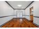 Empty dining room with wood floors, neutral walls, and natural light at 1021 Adah Ln, Lawrenceville, GA 30043