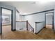Upstairs hallway features carpet, gray trim, and access to multiple rooms at 1021 Adah Ln, Lawrenceville, GA 30043