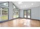 Sun-drenched sun room with tiled floors, multiple windows, and backyard views at 1021 Adah Ln, Lawrenceville, GA 30043