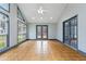 Rear sun room featuring tile flooring, gray trim, and multiple windows at 1021 Adah Ln, Lawrenceville, GA 30043