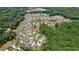 Aerial shot of a home nestled in a beautiful community, bordering lush woodlands, offering both privacy and neighborhood charm at 2861 Digna Ct, Acworth, GA 30101