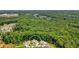 Aerial shot highlighting the property's proximity to the surrounding forest and the layout of the neighborhood at 2861 Digna Ct, Acworth, GA 30101