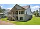 Back of home with a staircase to the backyard and lush lawn at 2861 Digna Ct, Acworth, GA 30101