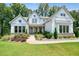 Charming two-story home with manicured lawn and beautiful landscaping; home has a welcoming porch at 2861 Digna Ct, Acworth, GA 30101