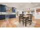Open concept design with hardwood floors and recessed lighting, connecting the bar, dining, and living spaces at 2861 Digna Ct, Acworth, GA 30101