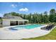 Community pool showcasing a well-maintained deck, plenty of seating, and a shaded pavilion for relaxation and enjoyment at 2861 Digna Ct, Acworth, GA 30101