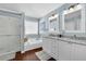 Bathroom features double sinks, white cabinetry, a soaking tub, and a separate shower at 3624 Bancroft Main Nw, Kennesaw, GA 30144