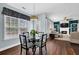 Charming dining area featuring a glass table and plenty of natural light at 3624 Bancroft Main Nw, Kennesaw, GA 30144