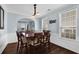 Dining room features a wooden table for six and three decorative mirrors at 3624 Bancroft Main Nw, Kennesaw, GA 30144