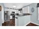 Well-lit kitchen with stainless steel appliances and dark countertops at 3624 Bancroft Main Nw, Kennesaw, GA 30144
