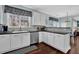 Bright kitchen with white cabinetry, stainless steel appliances, and dark countertops at 3624 Bancroft Main Nw, Kennesaw, GA 30144