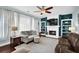 Inviting living room features a cozy fireplace, built-in shelves, and comfortable seating at 3624 Bancroft Main Nw, Kennesaw, GA 30144