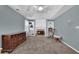 Cozy living room has a fireplace with built-in shelving, a ceiling fan, and natural light at 3624 Bancroft Main Nw, Kennesaw, GA 30144