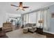 Bright and airy living room with hardwood floors, natural light, and comfortable furnishings at 3624 Bancroft Main Nw, Kennesaw, GA 30144