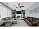 Cozy living room with a fireplace, built-in shelves, and neutral decor at 3624 Bancroft Main Nw, Kennesaw, GA 30144
