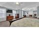Large main bedroom suite features an ensuite bathroom, fireplace, tv, and ample natural light at 3624 Bancroft Main Nw, Kennesaw, GA 30144
