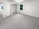 A spacious bedroom with a closet and a large window, providing ample natural light at 4726 Alpine Sw Dr, Lilburn, GA 30047