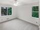 Well-lit bedroom with two large windows, creating a bright and airy atmosphere at 4726 Alpine Sw Dr, Lilburn, GA 30047