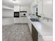 Large kitchen with generous counter space, modern appliances, and access to the dining area at 4726 Alpine Sw Dr, Lilburn, GA 30047
