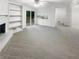 Inviting living space featuring built-in shelving, a fireplace, and access to an outdoor deck at 4726 Alpine Sw Dr, Lilburn, GA 30047