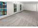 Spacious living room offering natural light, neutral walls and carpet, with direct entry from outside at 4726 Alpine Sw Dr, Lilburn, GA 30047