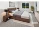 A serene bedroom featuring a plush bed, contemporary furnishings, and a large window view at 4726 Alpine Sw Dr, Lilburn, GA 30047
