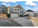 Inviting two-story home with a stone facade, two-car garage, and well-manicured lawn at 3240 Arbor Oaks Dr, Snellville, GA 30039