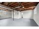 A large unfinished basement area with painted floors and exposed joists on the ceiling at 3284 Devaughn Ne Dr, Marietta, GA 30066