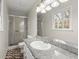 Bright bathroom with a granite countertop vanity, a frosted glass shower, and neutral wall paint at 3284 Devaughn Ne Dr, Marietta, GA 30066