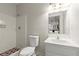 A bathroom with white vanity, neutral wall paint, and a shower with white tile walls at 3284 Devaughn Ne Dr, Marietta, GA 30066