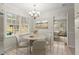 Cozy breakfast nook with a round table and a window overlooking the yard at 3284 Devaughn Ne Dr, Marietta, GA 30066