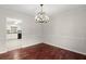 Bright dining room featuring hardwood floors and modern chandelier at 3284 Devaughn Ne Dr, Marietta, GA 30066