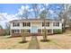 Charming two-story home with a light blue door, black shutters, and a well-manicured front yard at 3284 Devaughn Ne Dr, Marietta, GA 30066